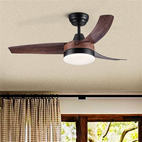 This 5-blade ceiling fan features a casual, classic silhouette and a light kit that features three bulbs with clear glass shades to illuminate your space. . Wayfair ceiling fans